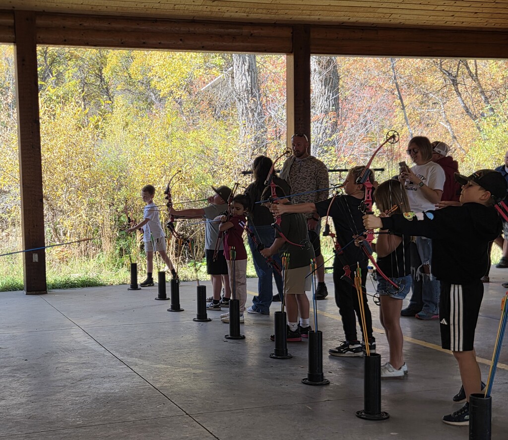 3rd grade students shooting archery
