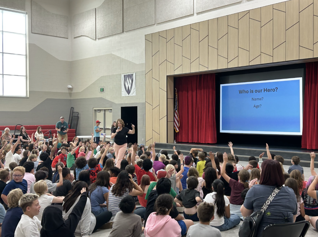 Jennifer A. Nielsen presenting in an assembly
