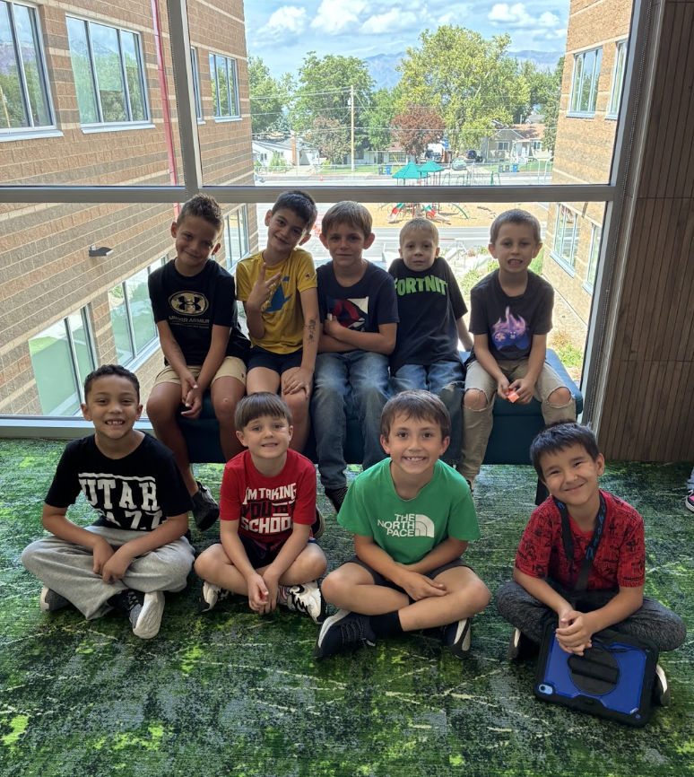 group of 9 boys all smiling
