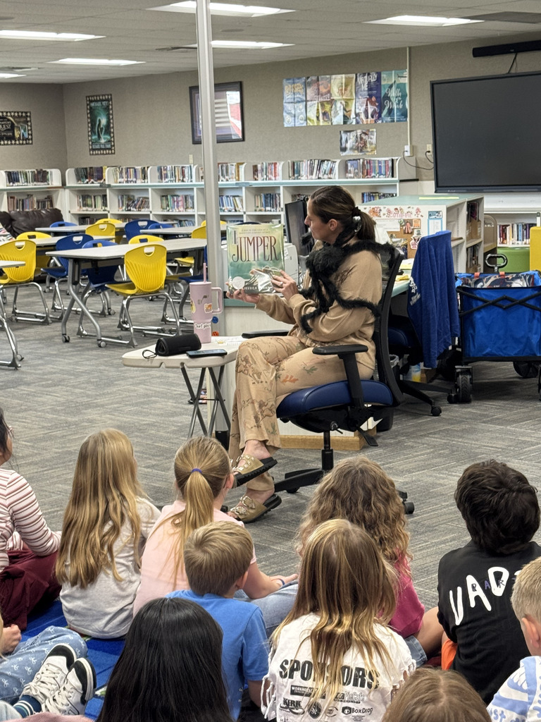 Librarian reading students a story