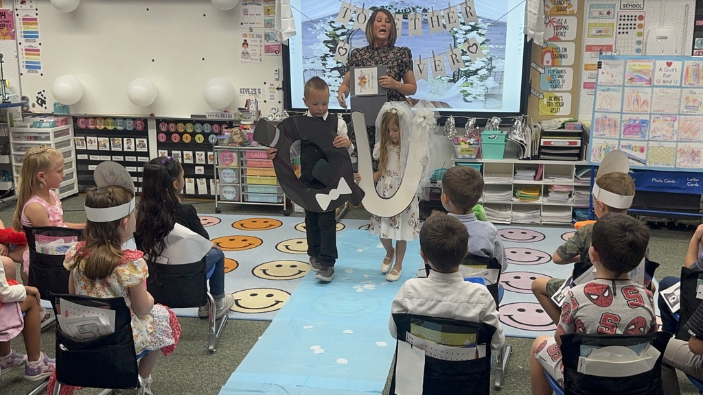 Teacher announcing Q and U wedding