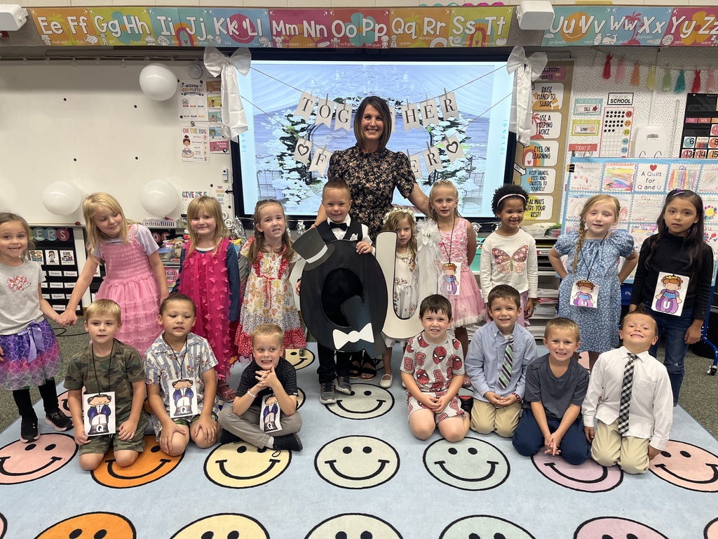 Teacher smiling with students
