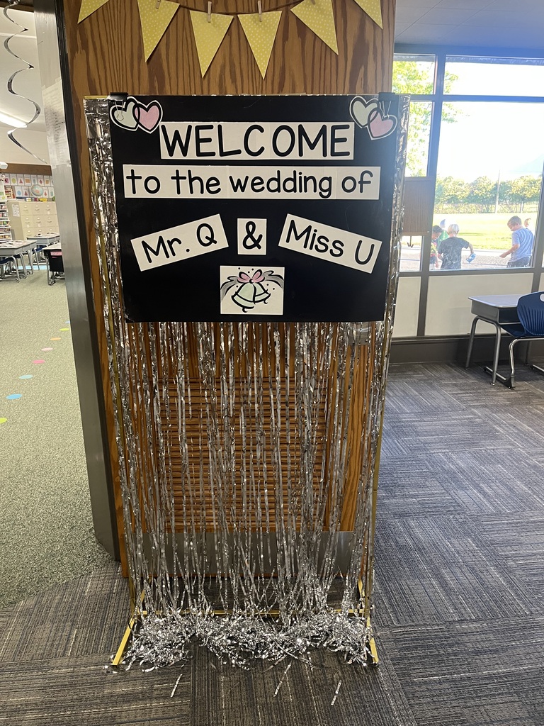 Sign that says "Welcome to the wedding of Mr. Q and Miss U"