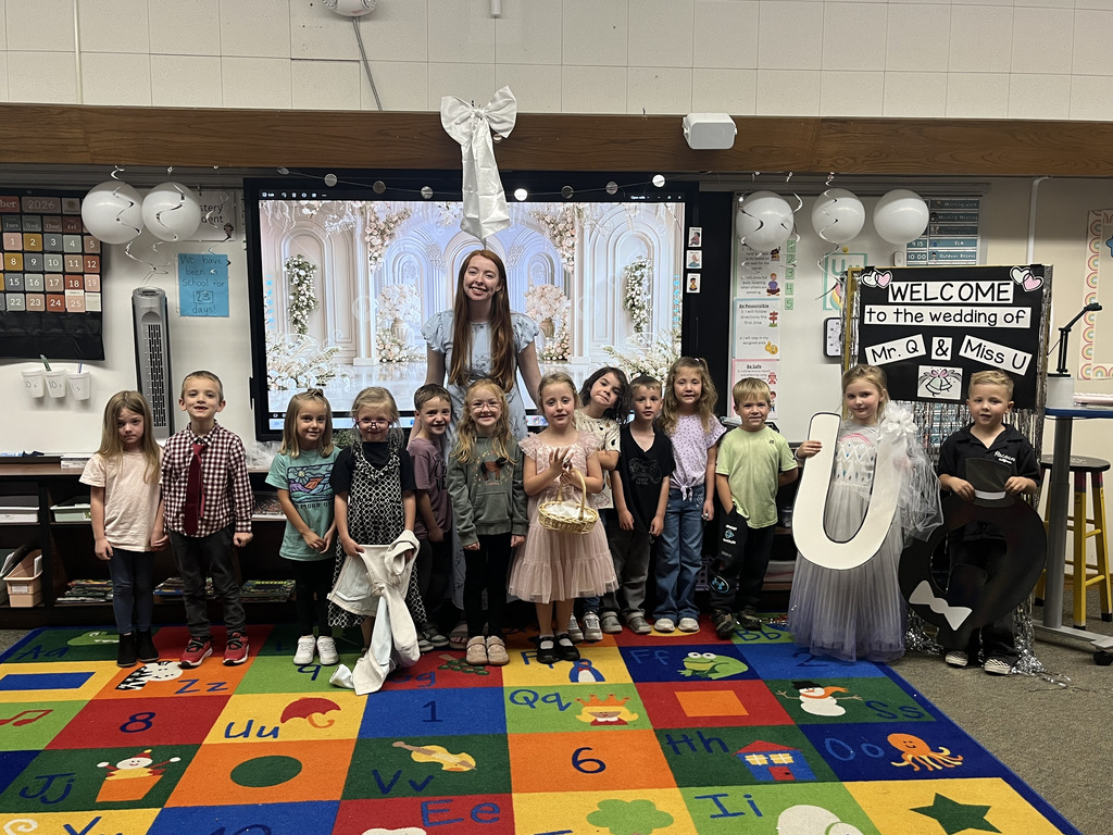 Teacher smiling with students