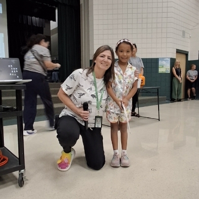Mrs. Jacobsen posing with girl