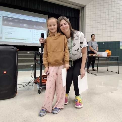 Mrs, Jacobsen posing with girl
