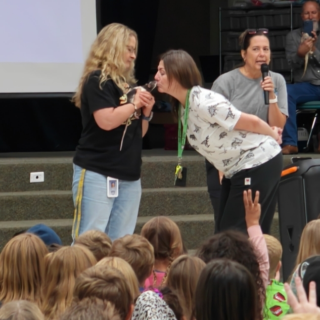 Mrs. Jacobsen kissing a rat