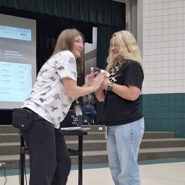 Mrs. Jacobsen getting the rat