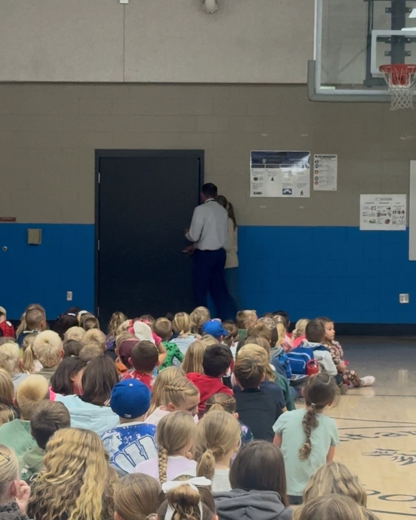 Photos from a school assembly at Hooper Elementary where students learned what it means to be a Mustang by showing grit, growth, and kindness. Additional photos feature a large Mustang mascot display that will be showcased at the front of the school.