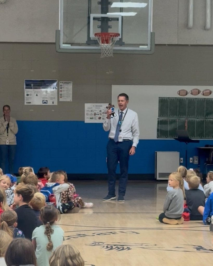Photos from a school assembly at Hooper Elementary where students learned what it means to be a Mustang by showing grit, growth, and kindness. Additional photos feature a large Mustang mascot display that will be showcased at the front of the school.