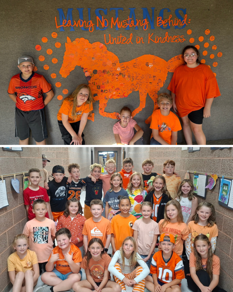Five Hooper Elementary students pose in front of a Unity Day display featuring a large orange mustang made of handwritten kindness messages. The bulletin board reads, “Leaving No Mustang Behind: United in Kindness.” A group of Hooper Elementary students pose together in a school hallway wearing orange and other bright colors to celebrate Unity Day and promote kindness, inclusion, and unity.