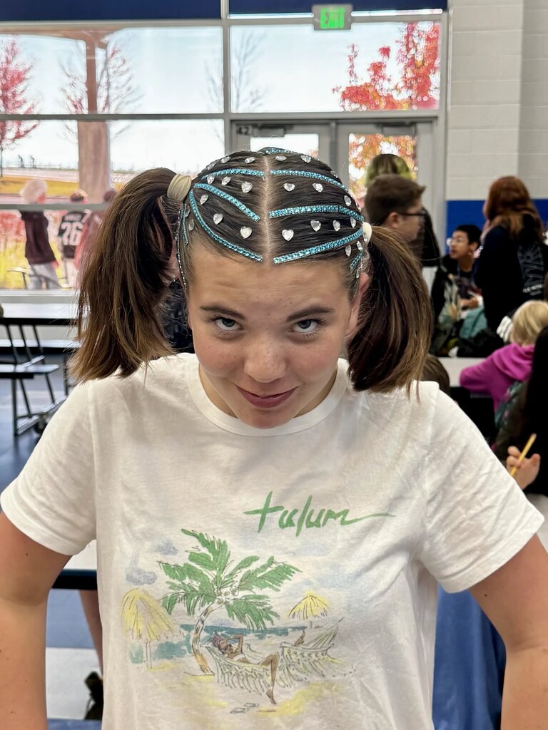 student with crazy hair