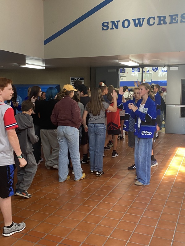 Snowcrest students welcoming guests for the Welcome Assembly