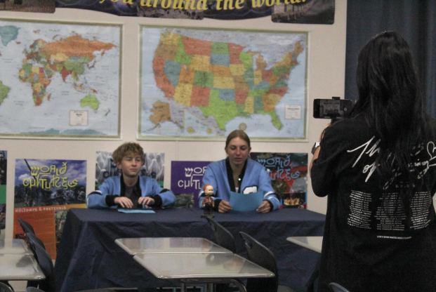 two students being recorded for Spartan News.