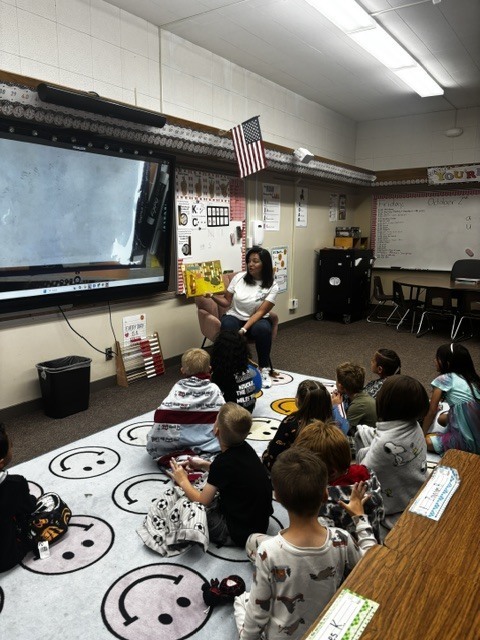 Mrs. Socwell reading to 1st graders