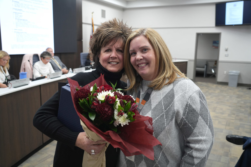 photograph at our board meeting of Matt Williams and Mrs. DiAne Morin receiving an award. 