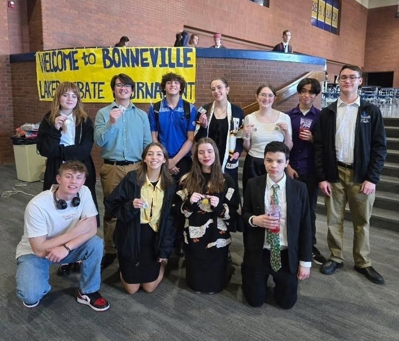Team pose at Bonneville home "Laker Debate Tournament."