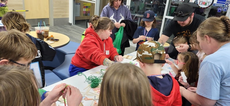 Students and families participating in stem challenges.