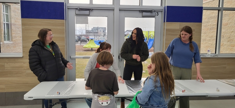 Students and families participating in stem challenges.