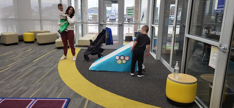 Students and families participating in stem challenges.