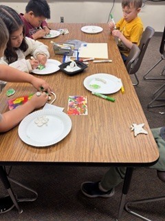 First graders making the life cycle of a butterfly