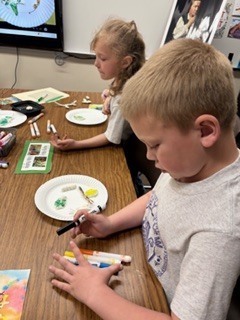 First graders making the life cycle of a butterfly