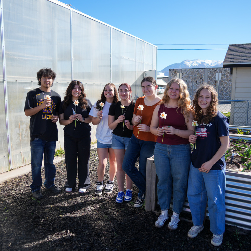 students with flowers