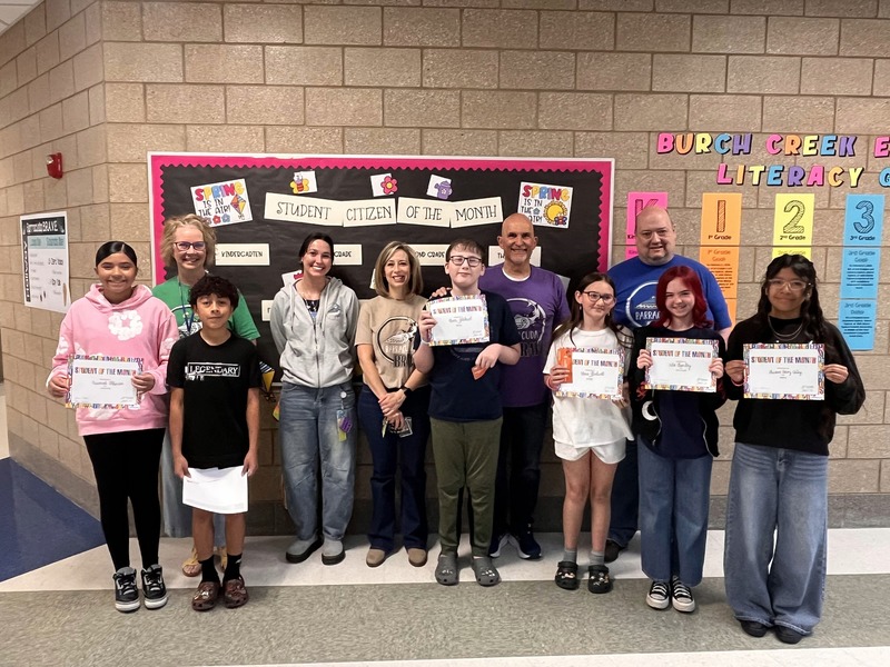 Teachers with their students that they awarded this month with student or citizen of the month. 