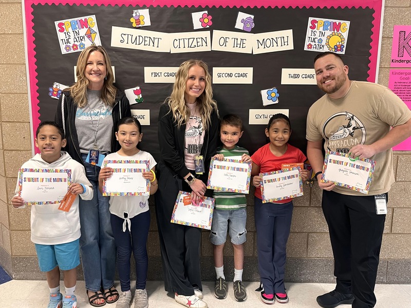 Teachers with their students that they awarded this month with student or citizen of the month. 
