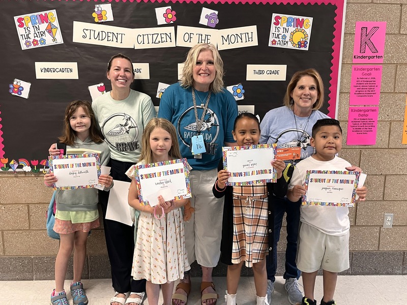 Teachers with their students that they awarded this month with student or citizen of the month. 