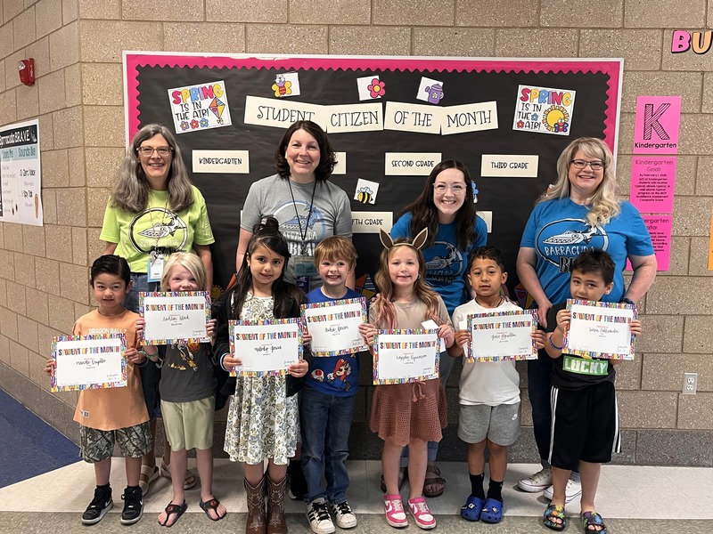 Teachers with their students that they awarded this month with student or citizen of the month. 