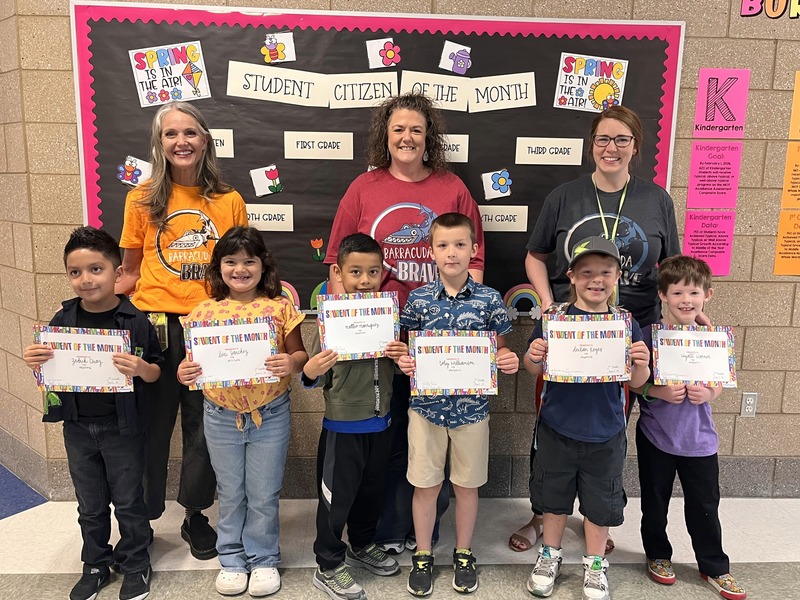 Teachers with their students that they awarded this month with student or citizen of the month. 
