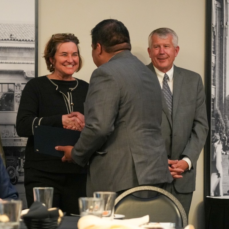 Superintendent handshake with nominee