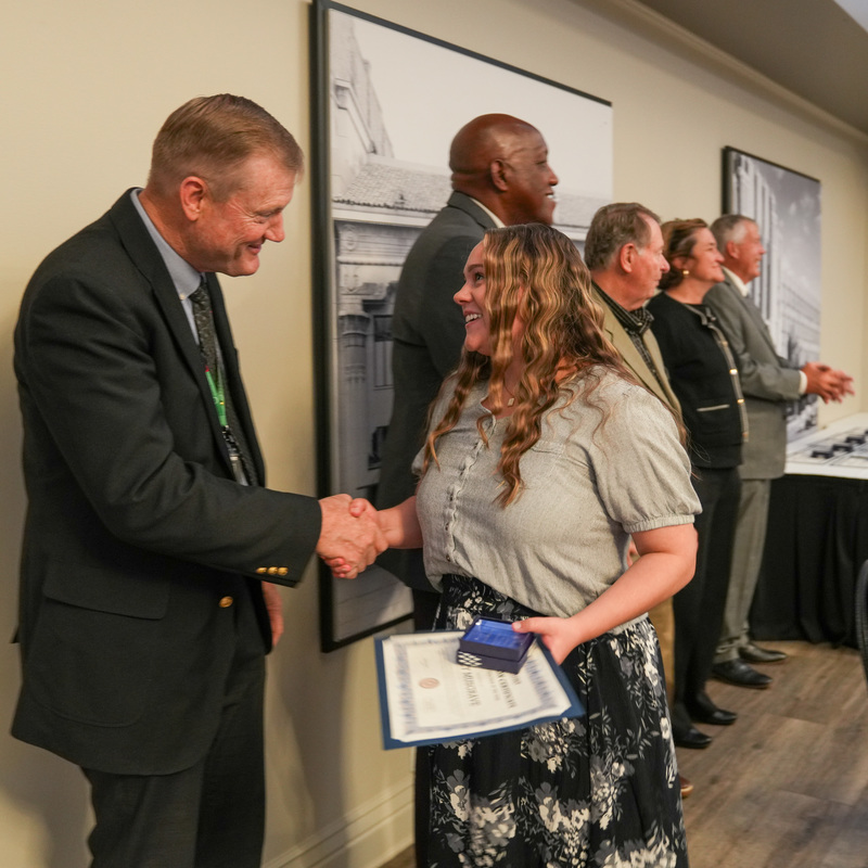 Nominees shaking hands with administration