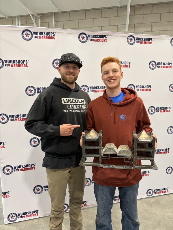 Bitter and Mr. Morgan with his project at the National Welding Competition
