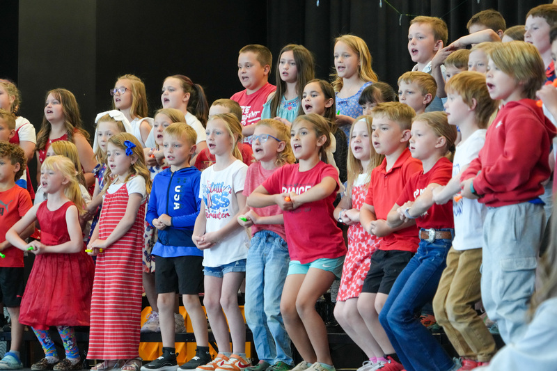 image of students performing in a program to celebrate the 250th anniversary of America
