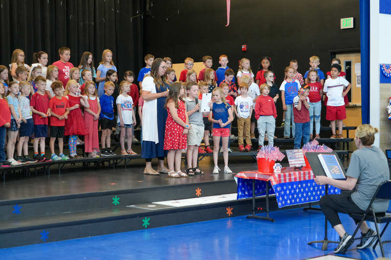image of students performing in a program to celebrate the 250th anniversary of America