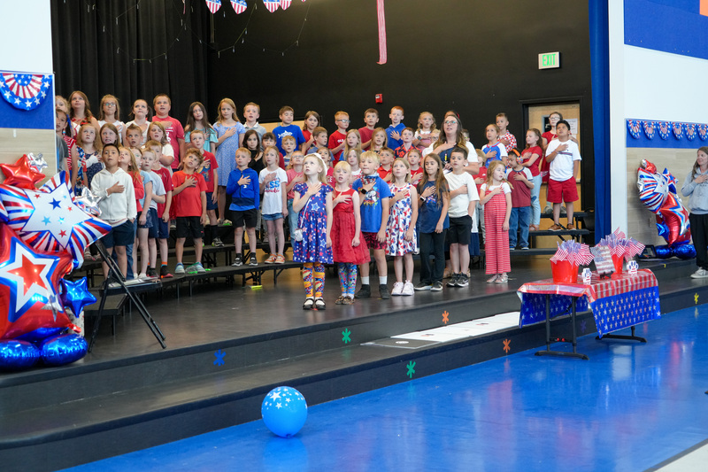 image of students performing in a program to celebrate the 250th anniversary of America