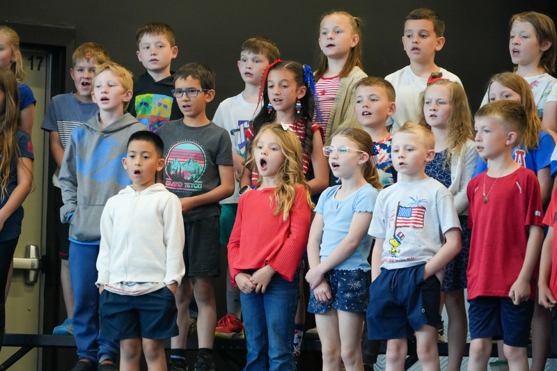 image of students performing in a program to celebrate the 250th anniversary of America