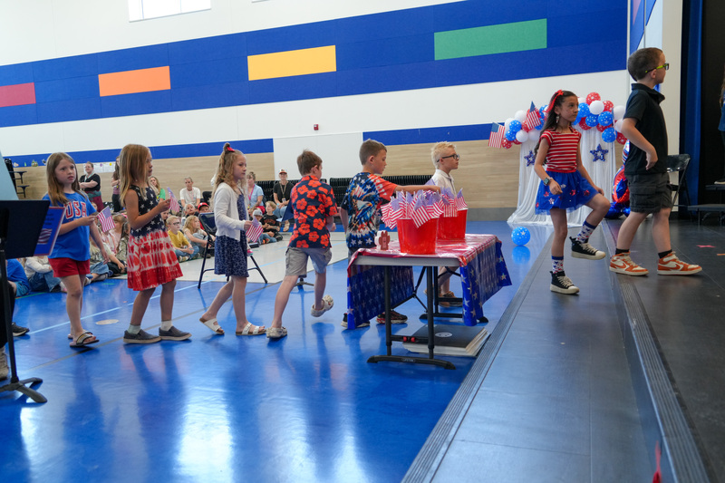 image of students performing in a program to celebrate the 250th anniversary of America