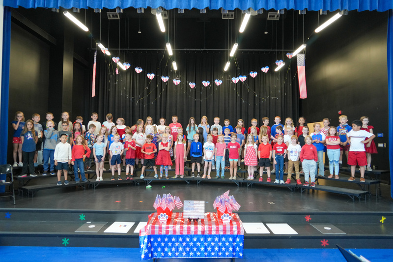 image of students performing in a program to celebrate the 250th anniversary of America