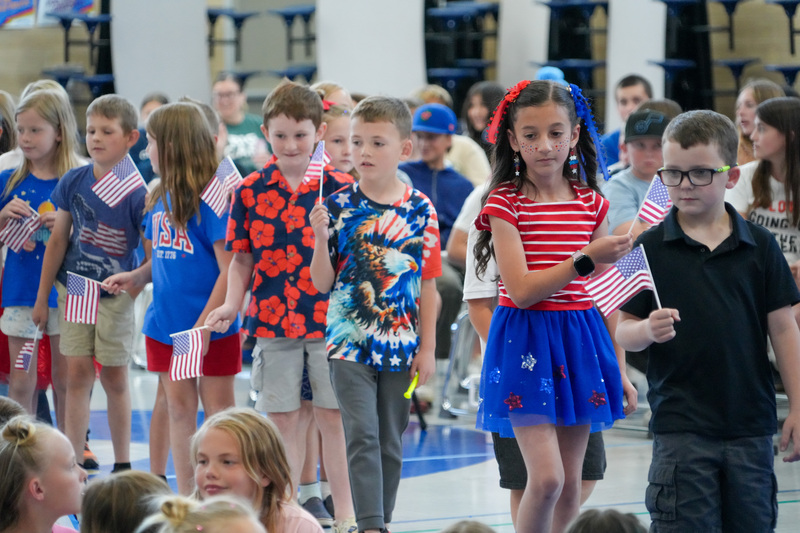 image of students performing in a program to celebrate the 250th anniversary of America