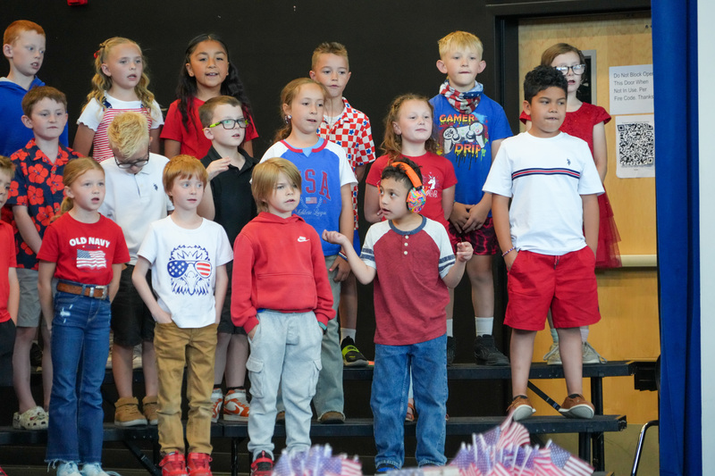 image of students performing in a program to celebrate the 250th anniversary of America