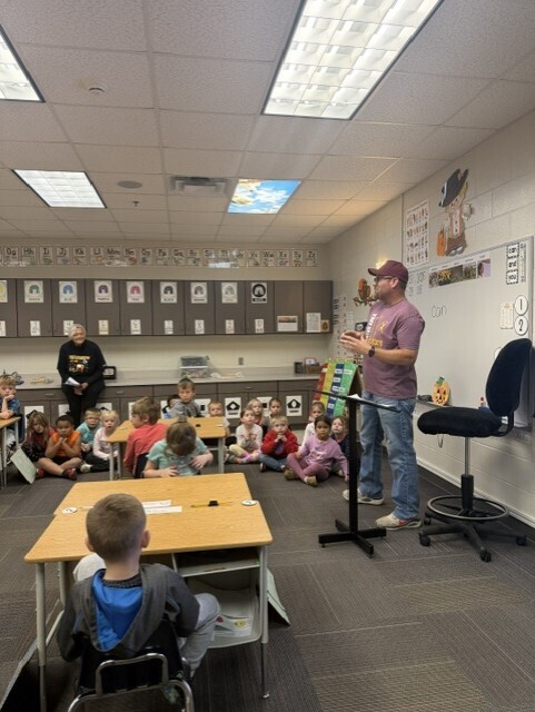 bus driver talking to kindergarteners about bus safety
