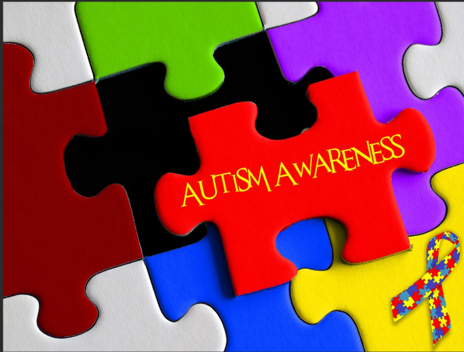 puzzle  with a piece labeled autism awareness