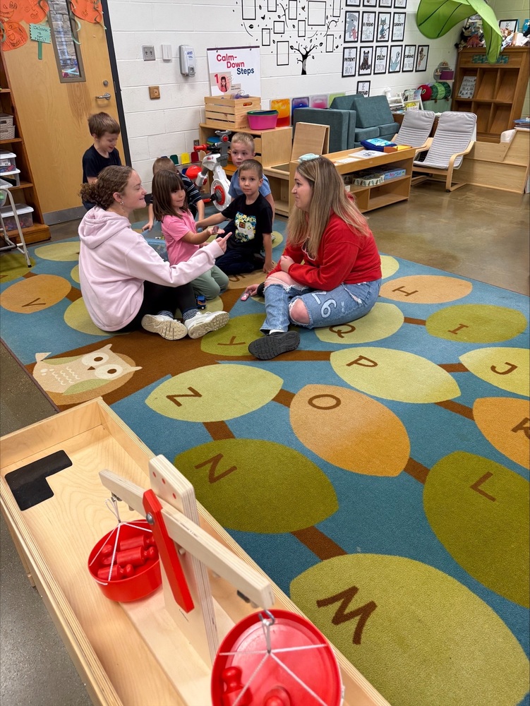 Children on a rug playing together