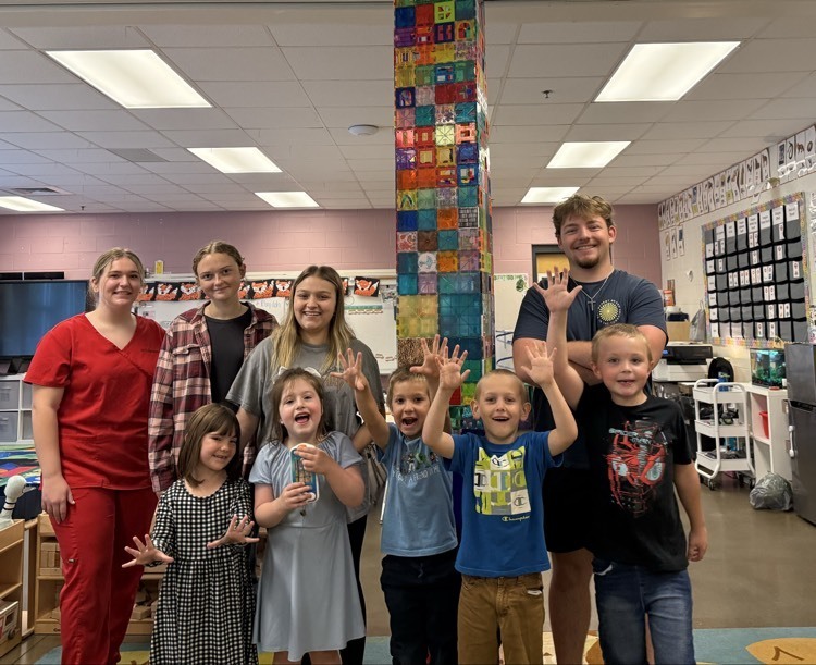 kindergarten and senior mentors posing for a photo