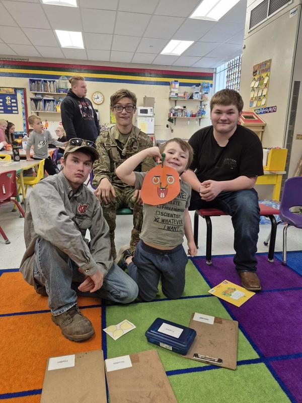 Children showing off their artwork