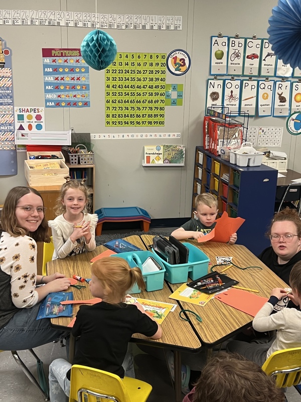 Children doing a craft at a table