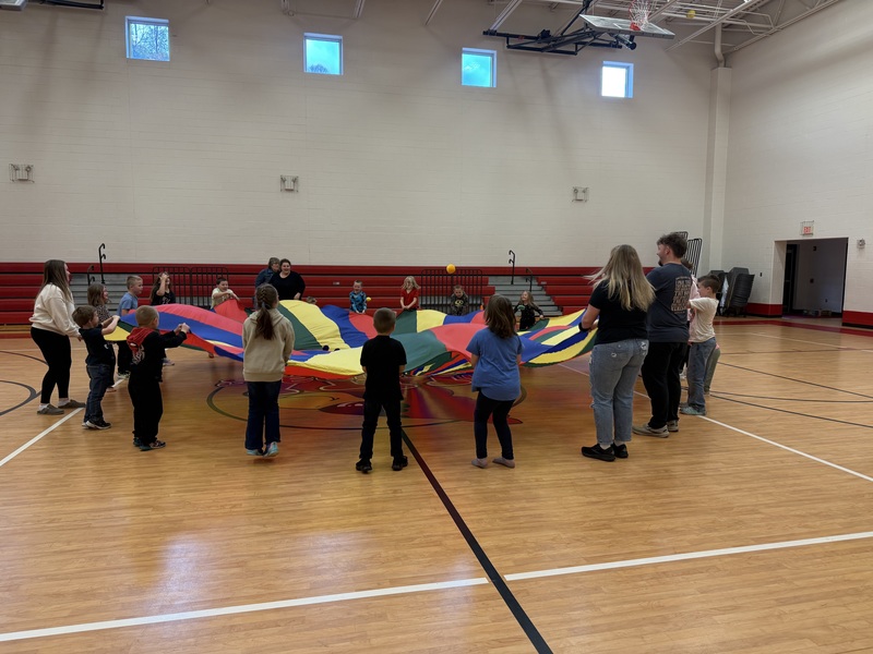Children playing with a parachute